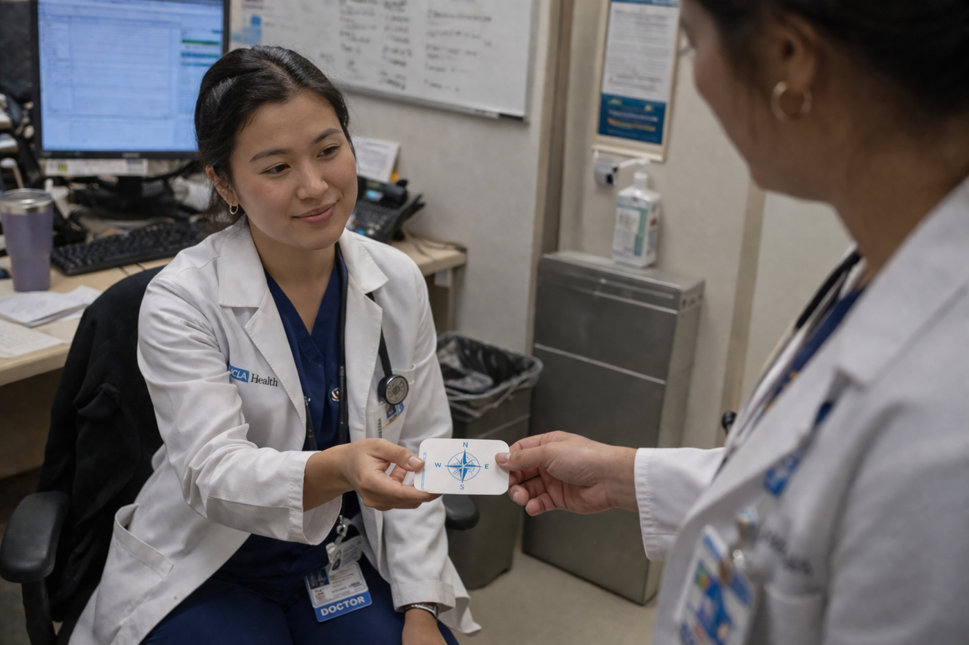 The Provider — Holding the Compass card, she pauses for a moment between patients. It offers a quiet sense of direction when the day feels heavy, helping her reconnect to what matters, steady her focus, and move forward with intention rather than exhaustion.