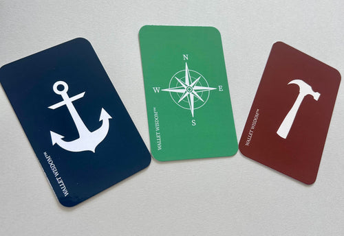 Wallet Wisdom Anchor Compass and Hammer cards side by side showing all three card types in navy green and red